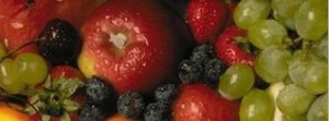 Fresh fruit: green grapes, apple, blueberry, bing cherry, and strawberries.