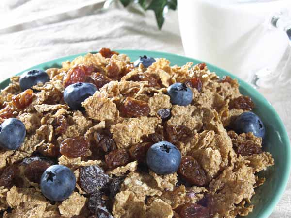 High angle view of corn flakes with blueberries in a bowl