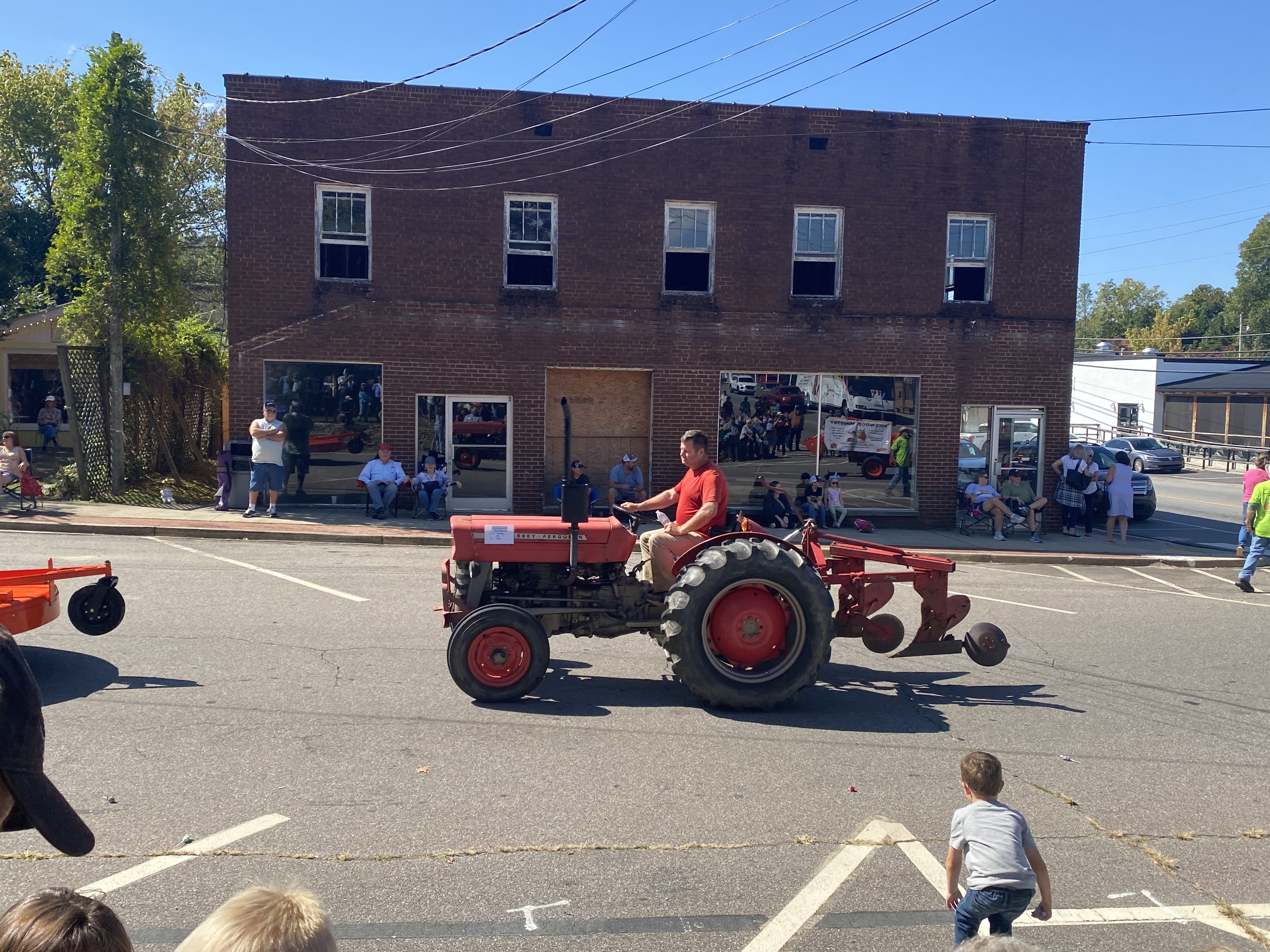 orange tractor in parade