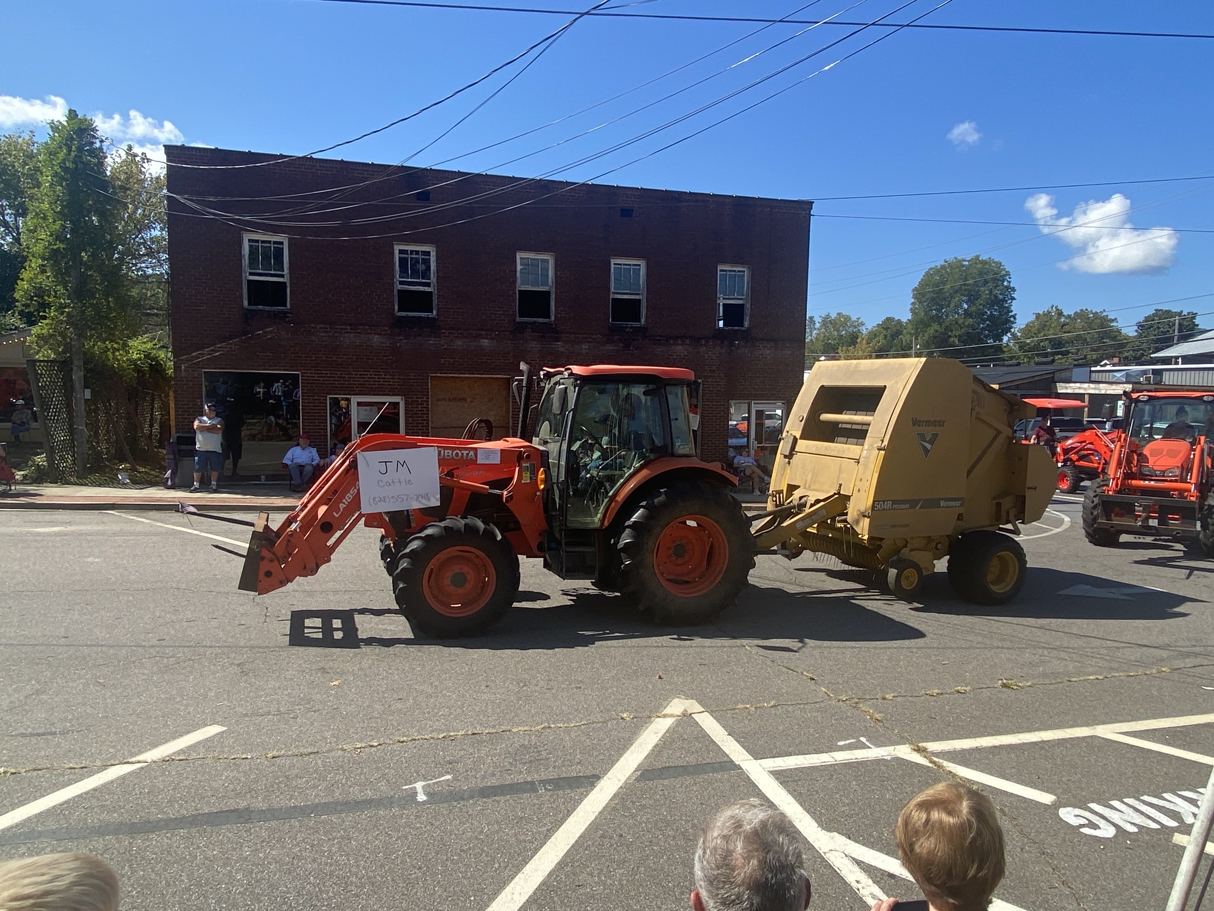 orange tractor pulling equipment