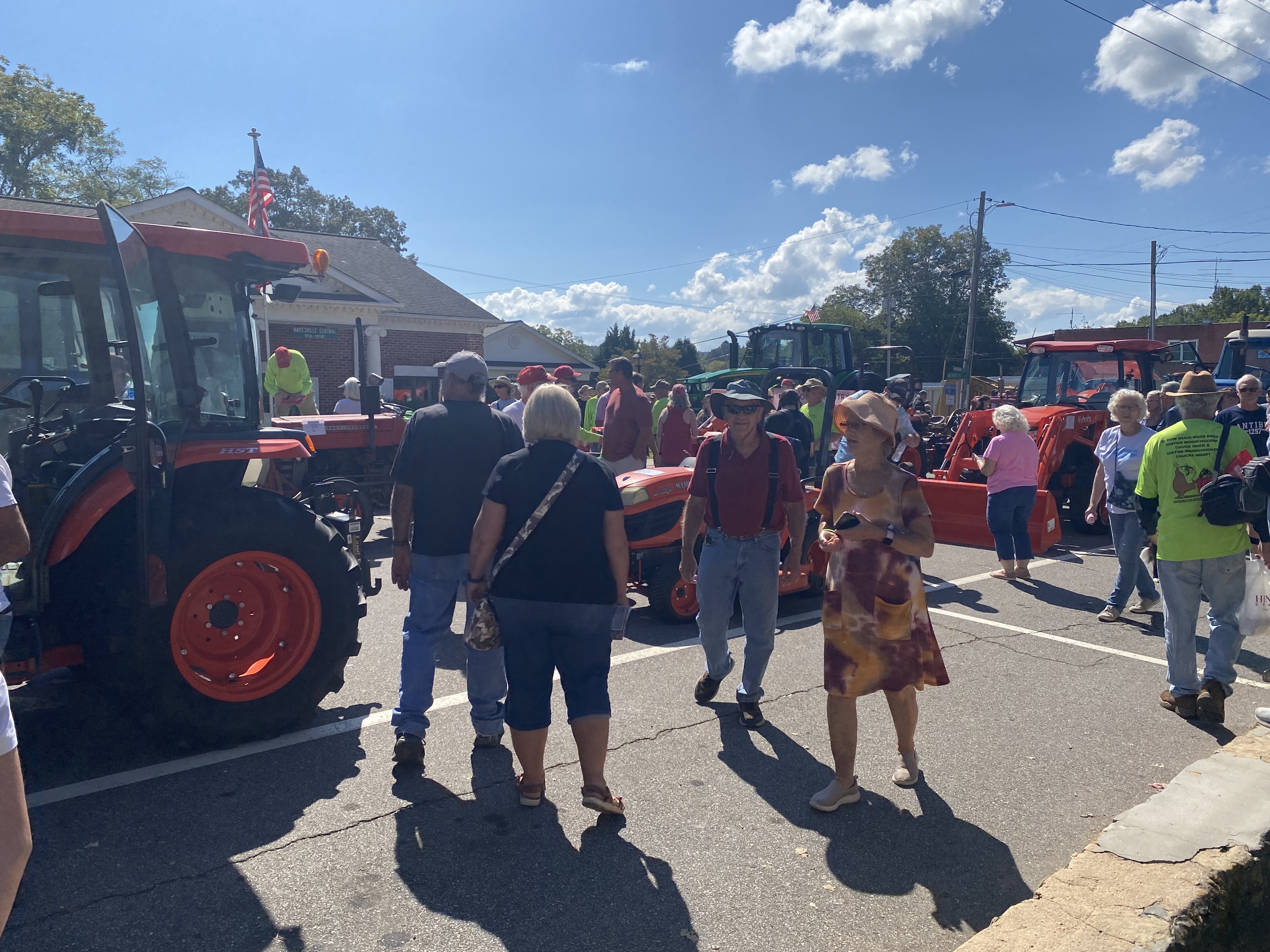 crowd and line of tractors