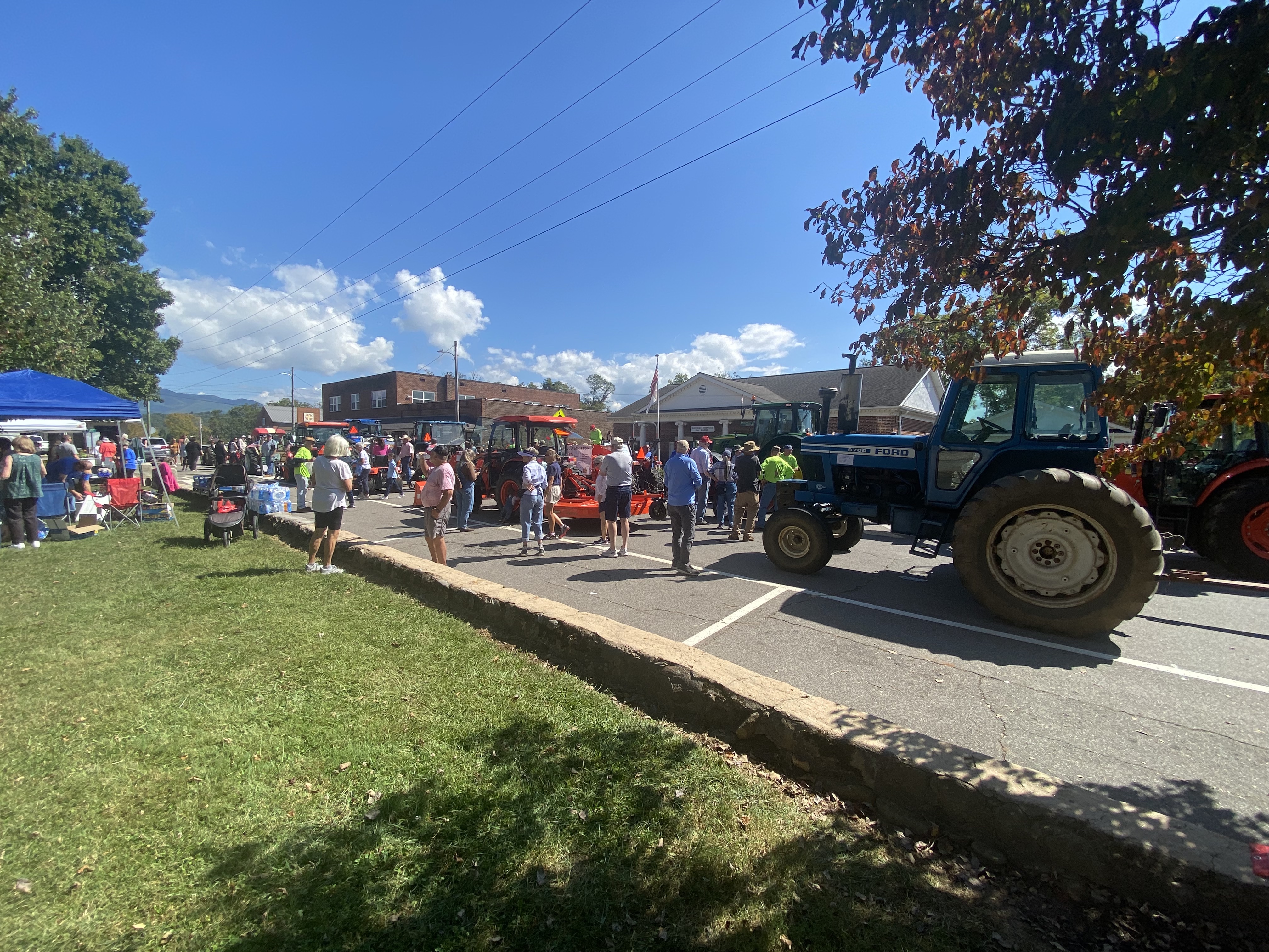 crowd with tractors in street
